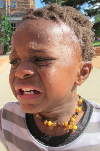 This is what a baby looks like when you tell him it is time to leave the splash pad. 